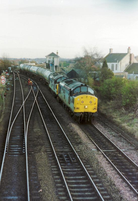 Photo of 37184 & 111(I think!) with the Bishopbriggs Tanks at Grangemouth Junc.