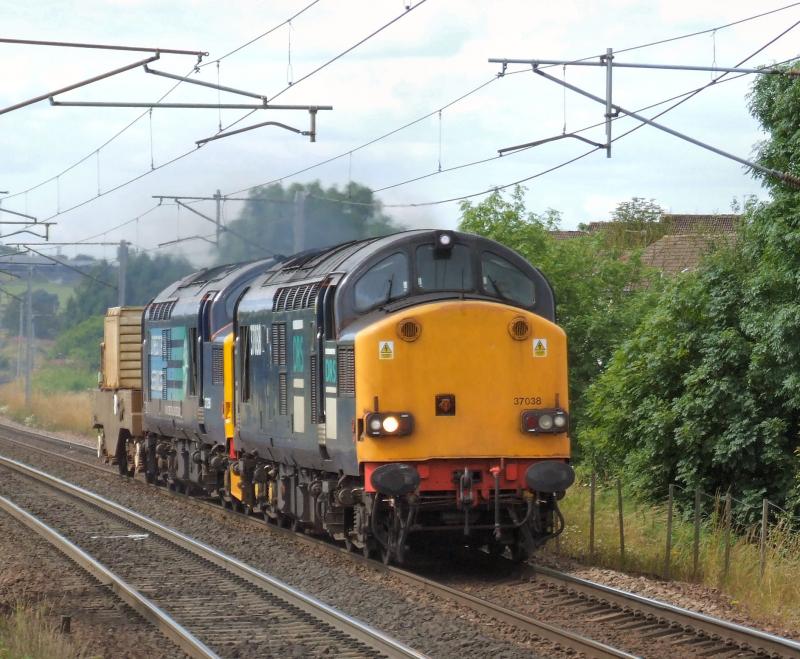 Photo of 37038 & 259 power through Carluke with 6M22 for Sellafield.