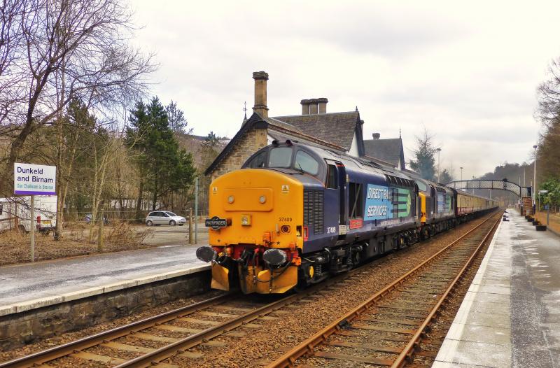 Photo of 37409 and 37607 power through Dunkeld with the late running Eastern Highlander Railtour to Pitlochry on 31st March 2013 