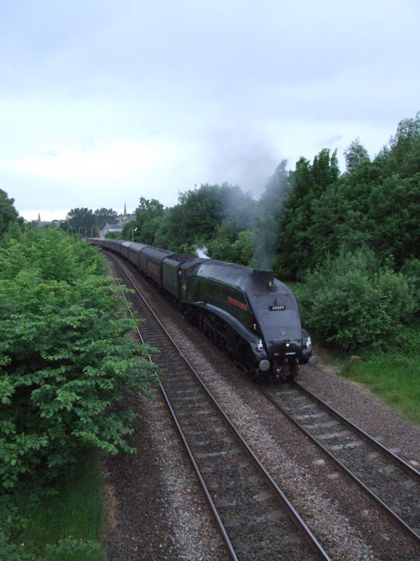 Photo of 60009 accelerates away from a station stop at Stirling.