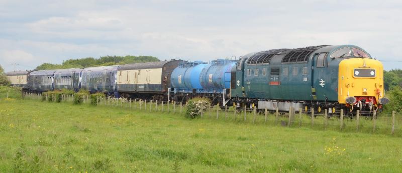 Photo of 06-17 Deltic 22 brings refurbished 334030 past Gatehead working from Kilmarnock to Yoker.JPG