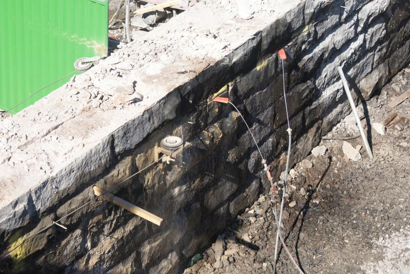 Photo of A close up of the blind side of the cheesewire sawing in progress at Shore Road