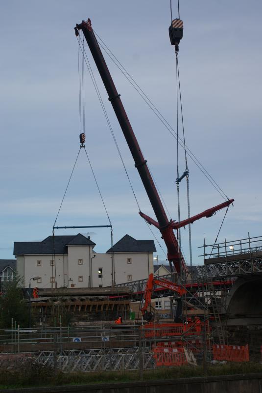 Photo of A deck section of Span 1 gets lifted out