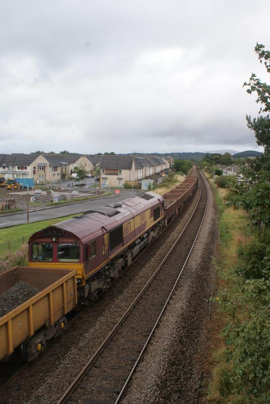 Photo of 66171 on 6K12 attached onto the back of 6K11 at Cornton with 66113 in the distance