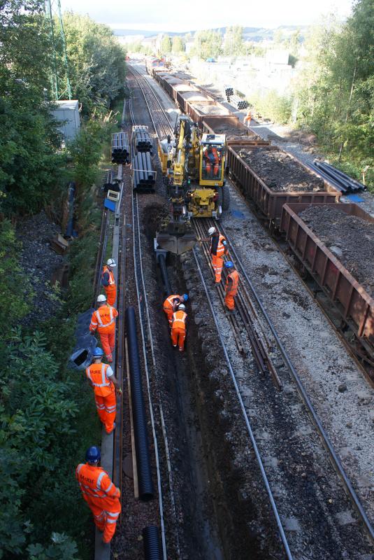 Photo of Drainage getting installed north of Kerse Road with 66105 on 6K16 servicing the works