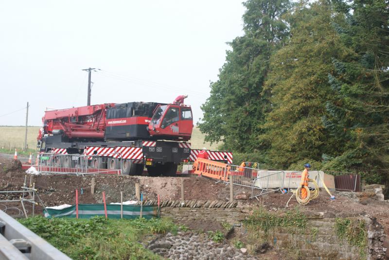 Photo of The crane just in the process of setting up at Mill of Keir.