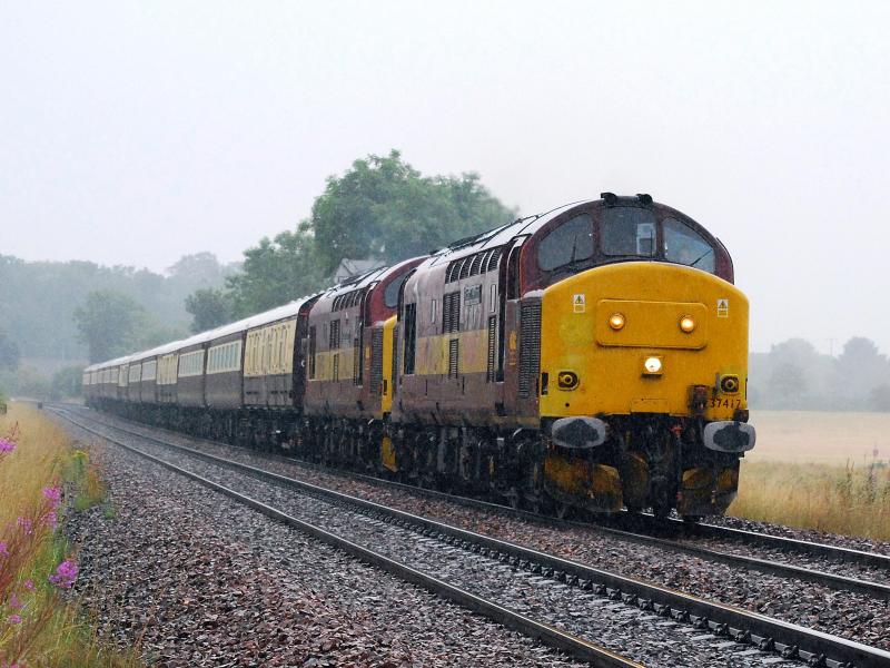 Photo of Tractors in full rain 