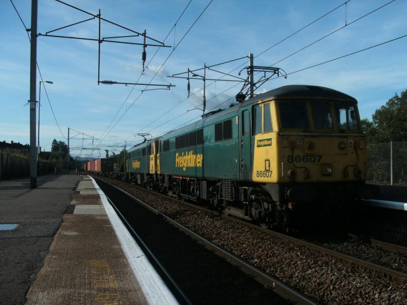 Photo of 86607 and 86*** passing through coatbridge central station 